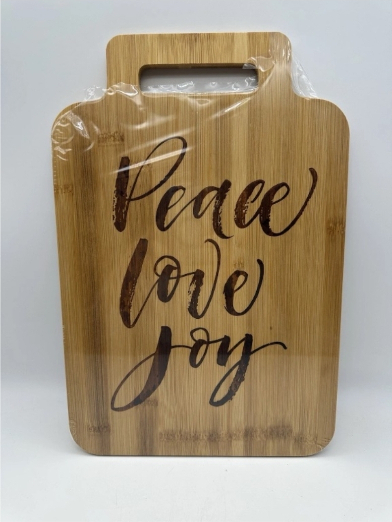 Wood cutting board saying Peace Love Joy.jpg